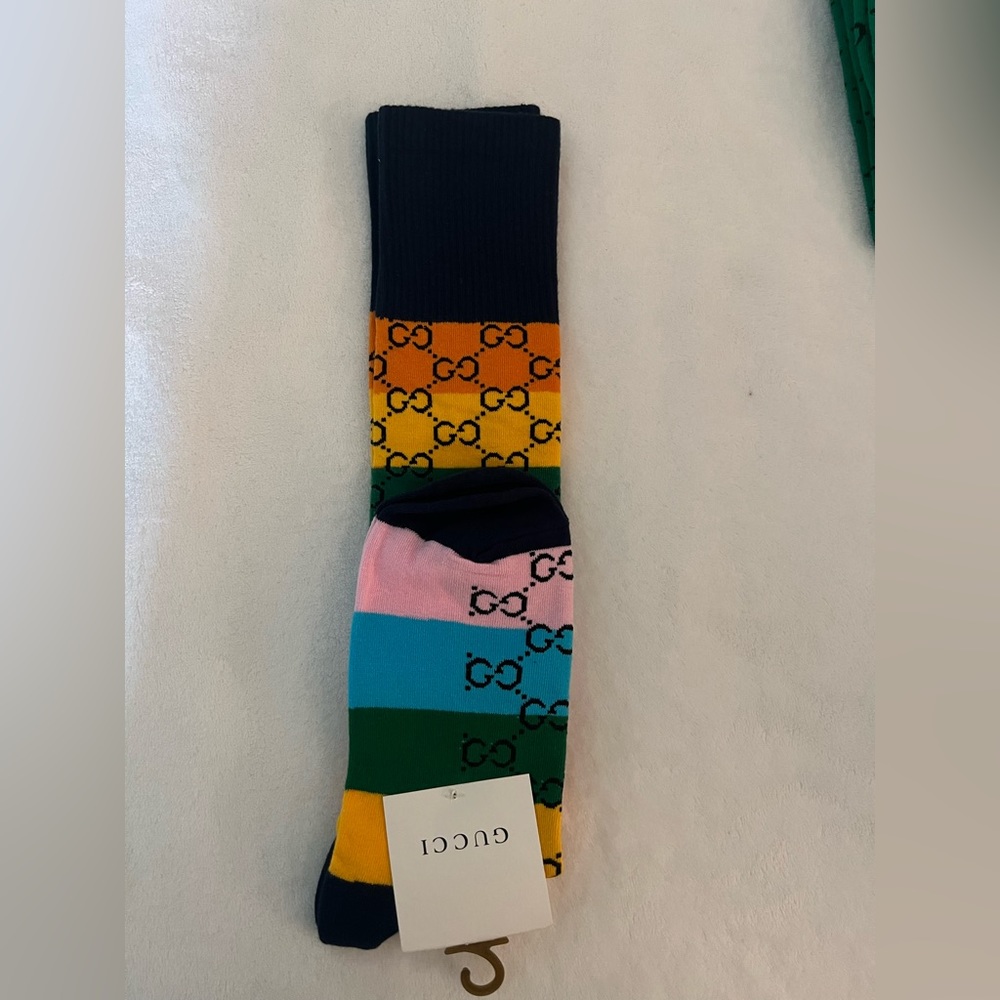 Knee high Gucci socks.